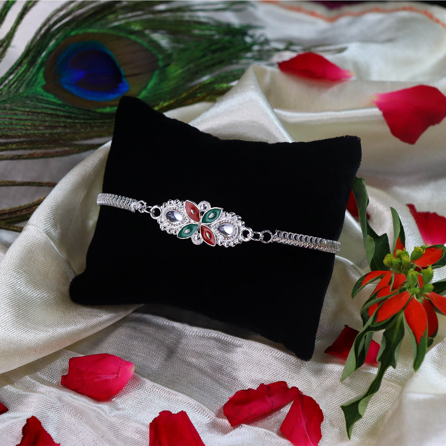 Elegant Floral Rakhi With Red-green Enamel Work And Metal Chain Elegant Floral Rakhi With Red-green Enamel Work And Metal Chain